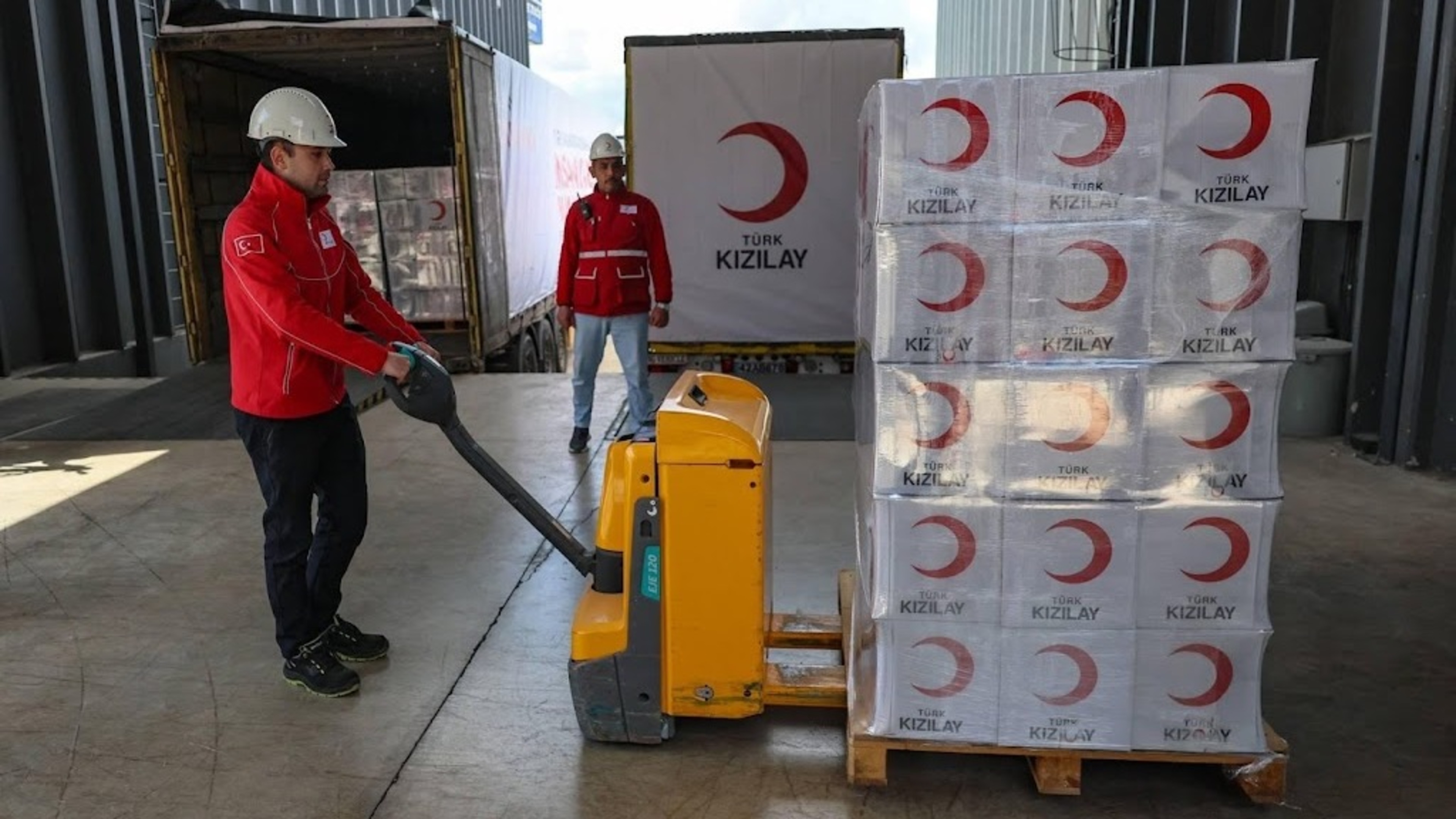 Red Cross workers supply Iran by land