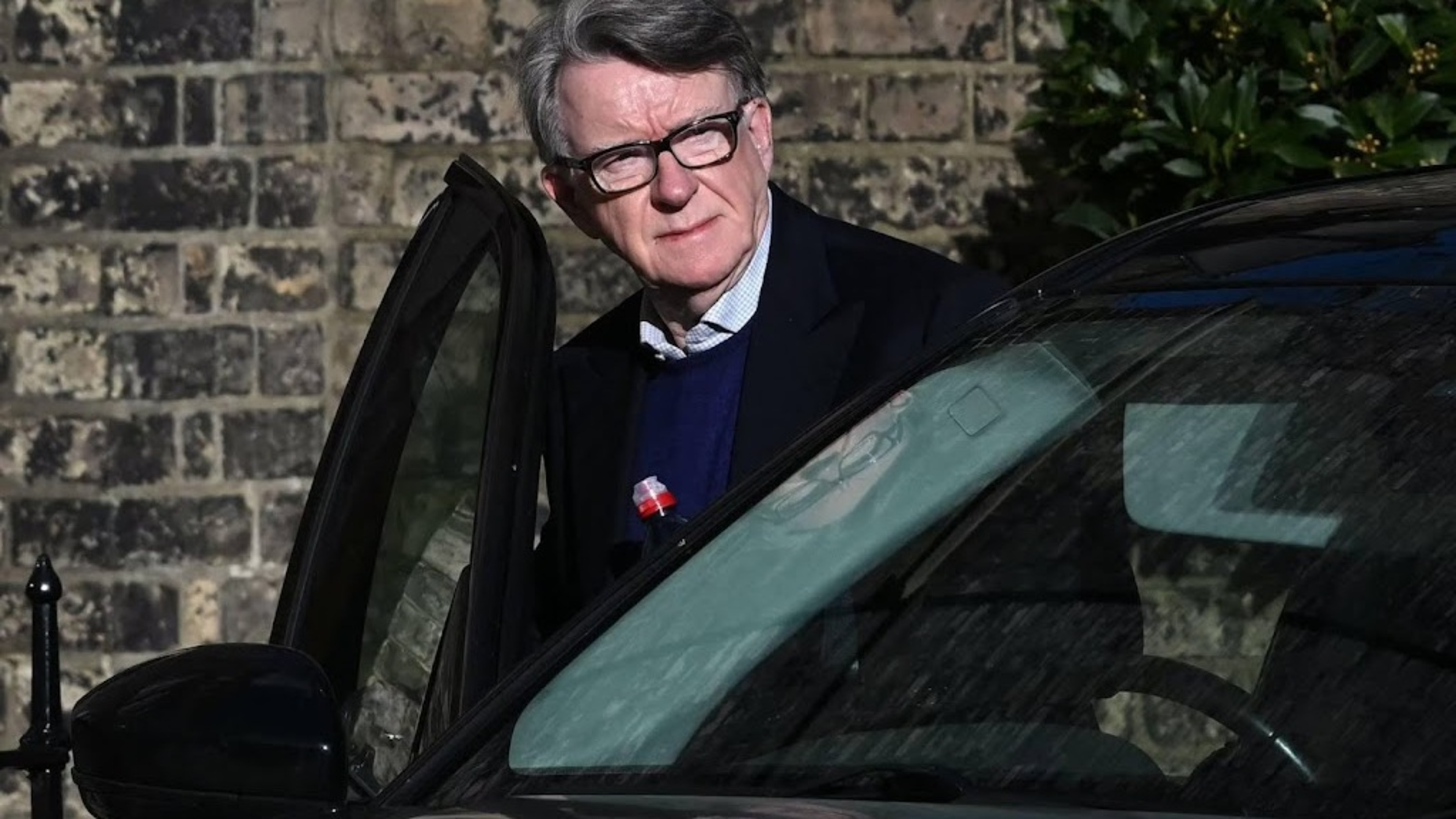 Controversial Mandelson taken away by police
