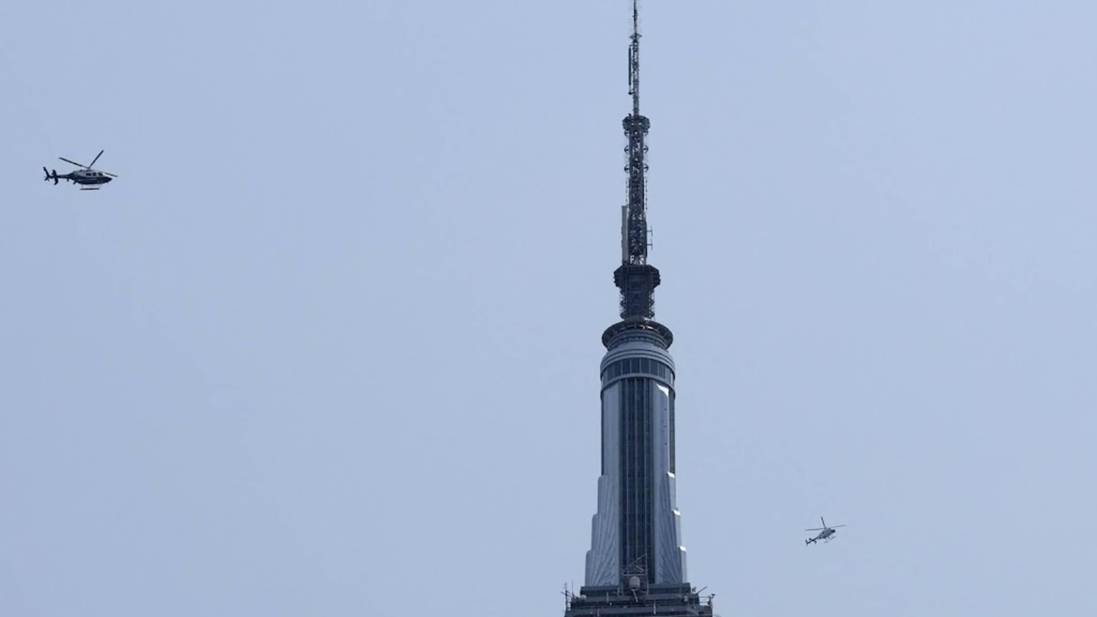 Climbers hang banner from the spire of the Empire State Building