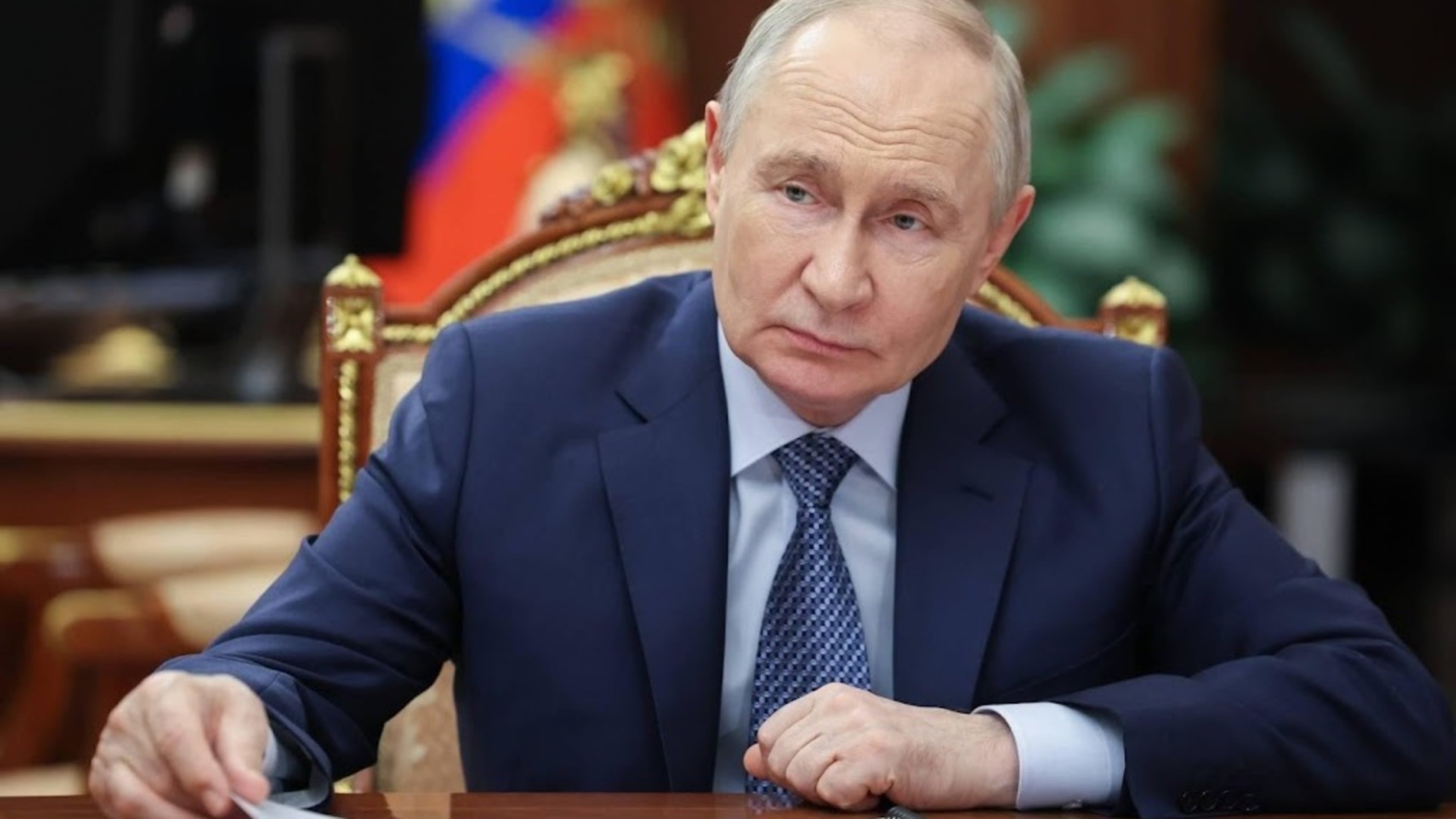 Putin signs asset seizure law targeting critics who fled