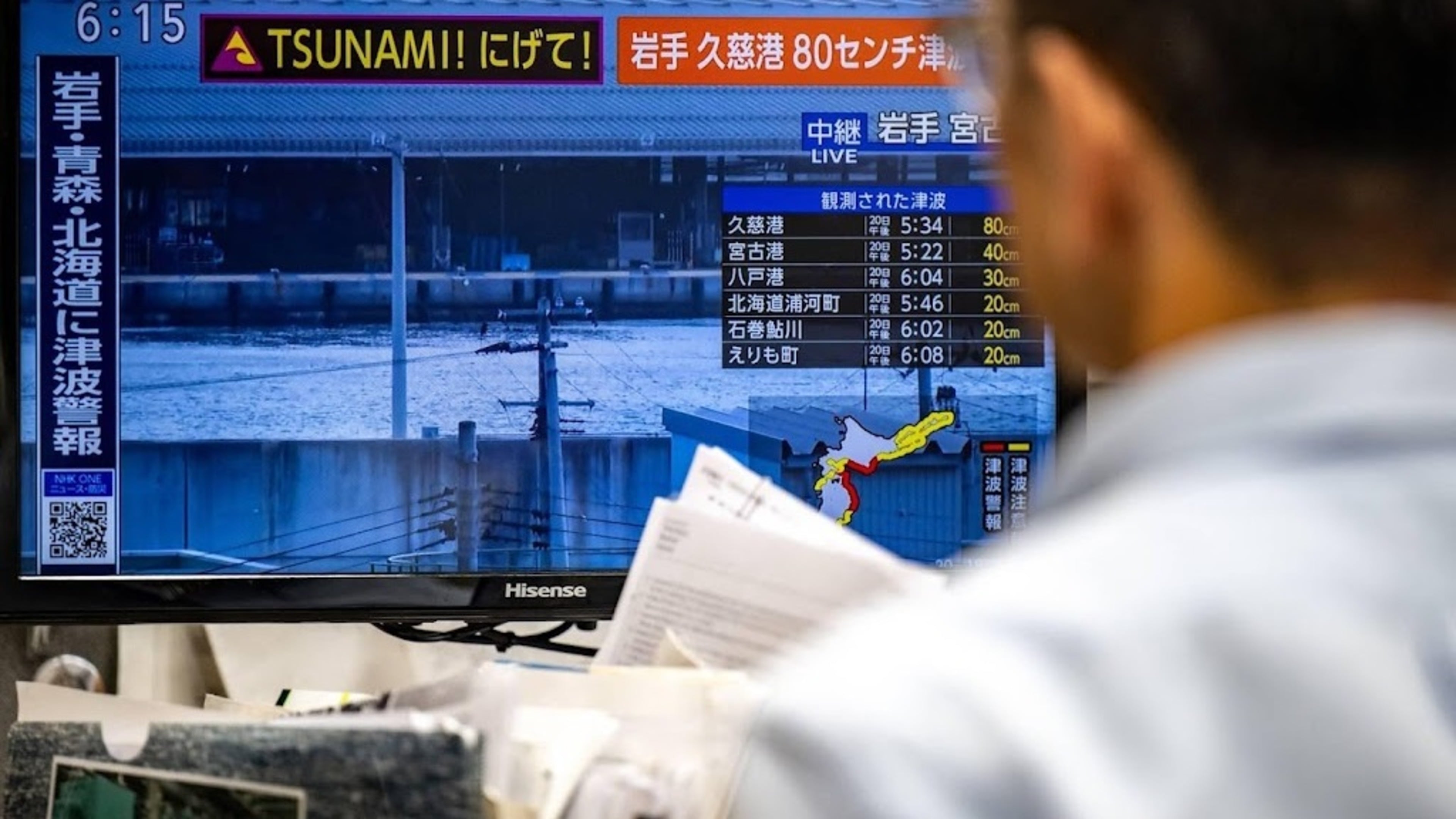 Japan warns of more quakes, lifts tsunami warning