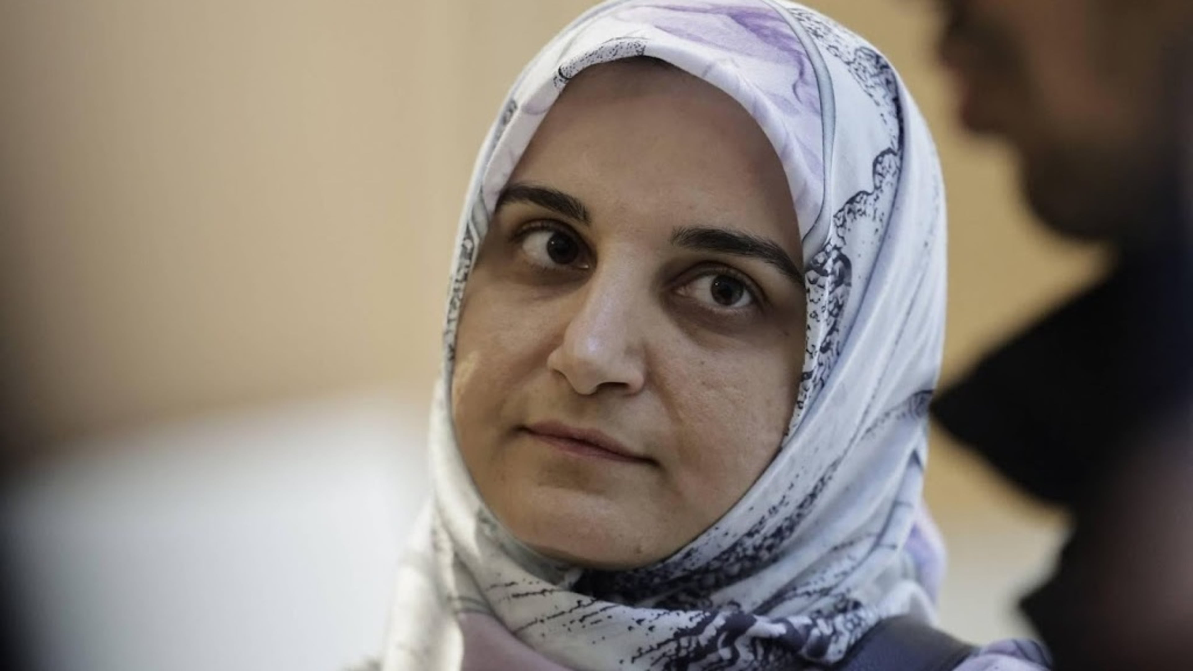 Iranian released by France returns home