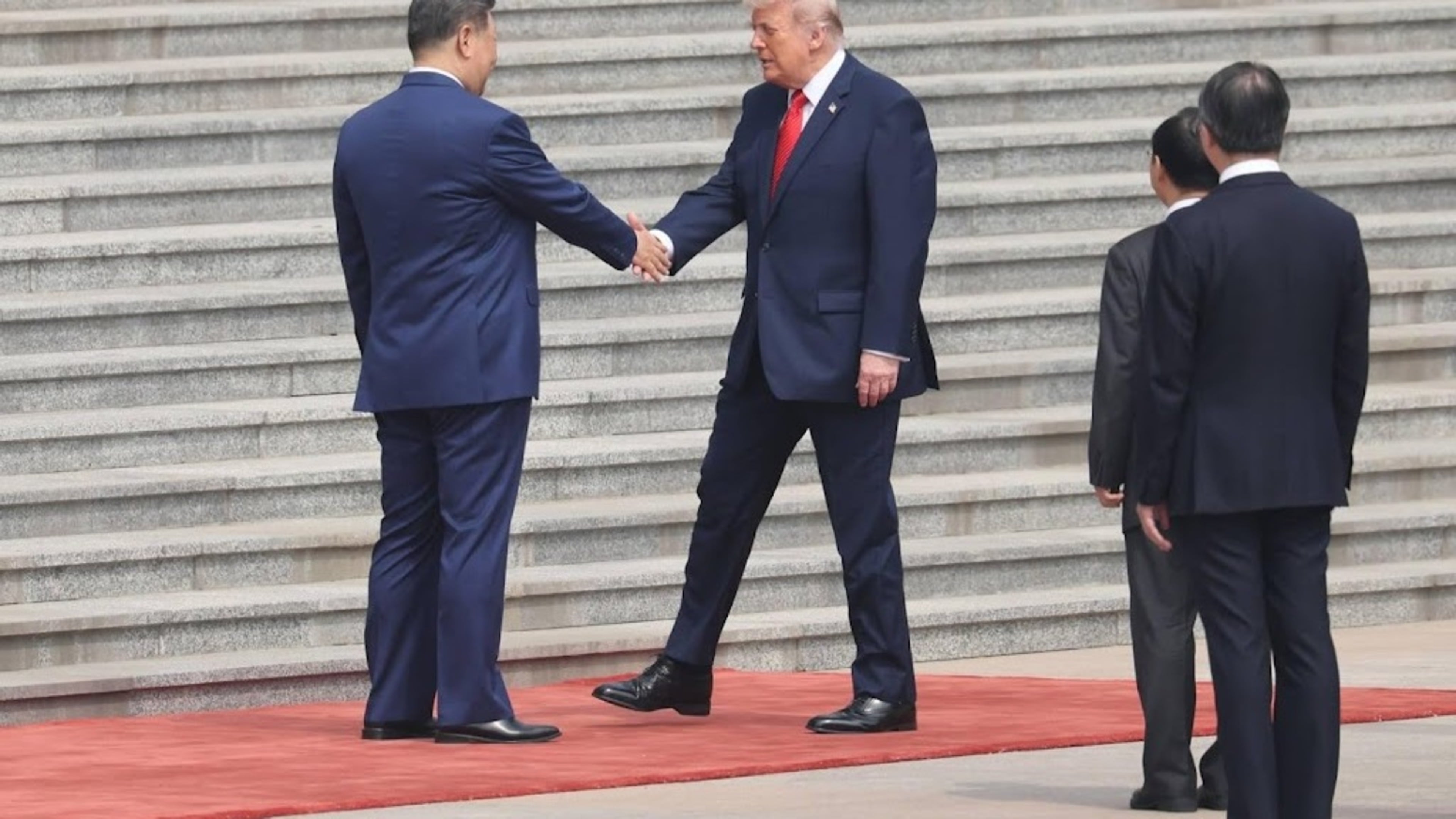 Trump and Xi start meeting in Beijing with handshake